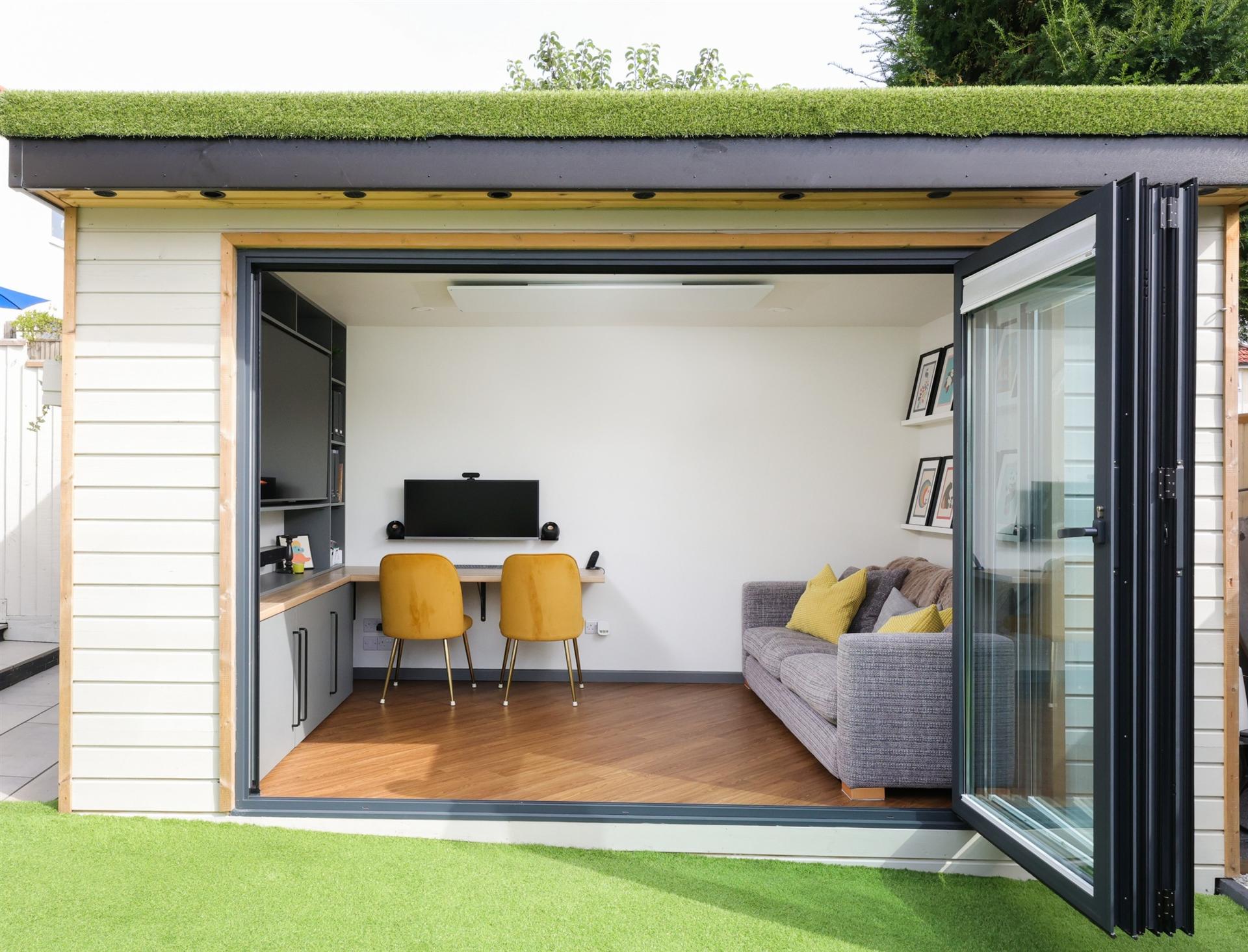 Garden studio with bifold doors open to the workspace