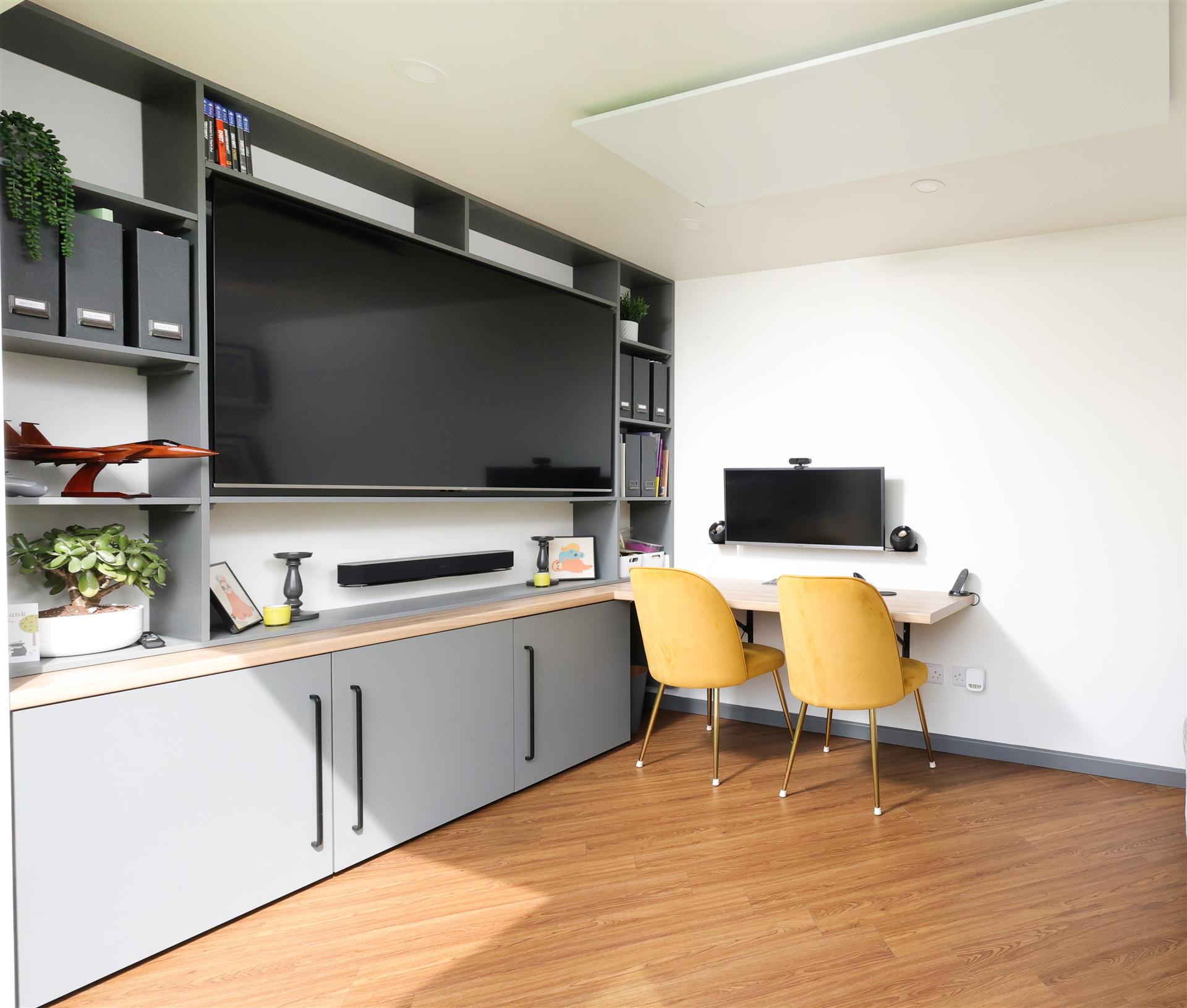 Fitted media unit and desk inside the garden studio