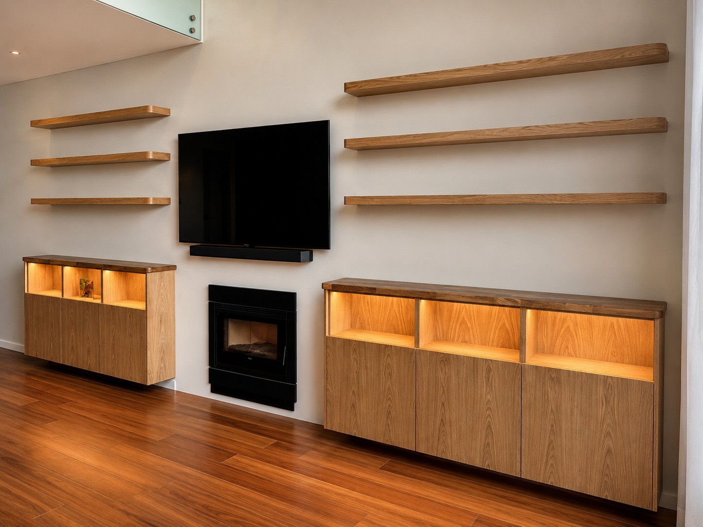 Handmade oak media wall with floating shelves in Lourel, Sintra by Nest